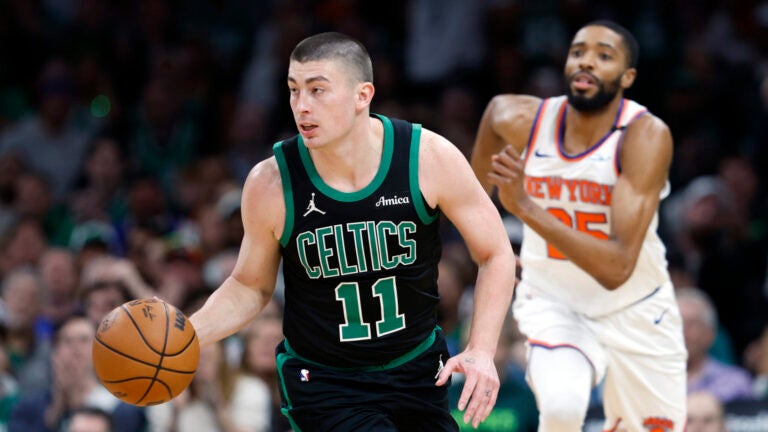 Boston Celtics guard Payton Pritchard (11) dribbles during game five of the NBA Eastern Conference semifinal against the New York Knicks at TD Garden.