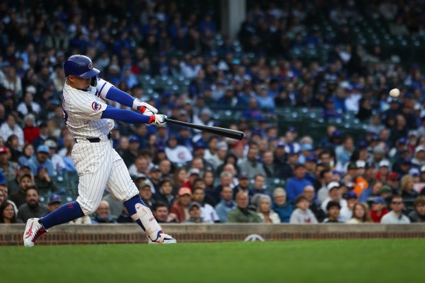 Chicago Cubs outfielder Seiya Suzuki (27) hits an RBI double to drive in Kyle Tucker during the first inning against the Colorado Rockies on Wednesday, May 28, 2025, at Wrigley Field. (Audrey Richardson/Chicago Tribune)