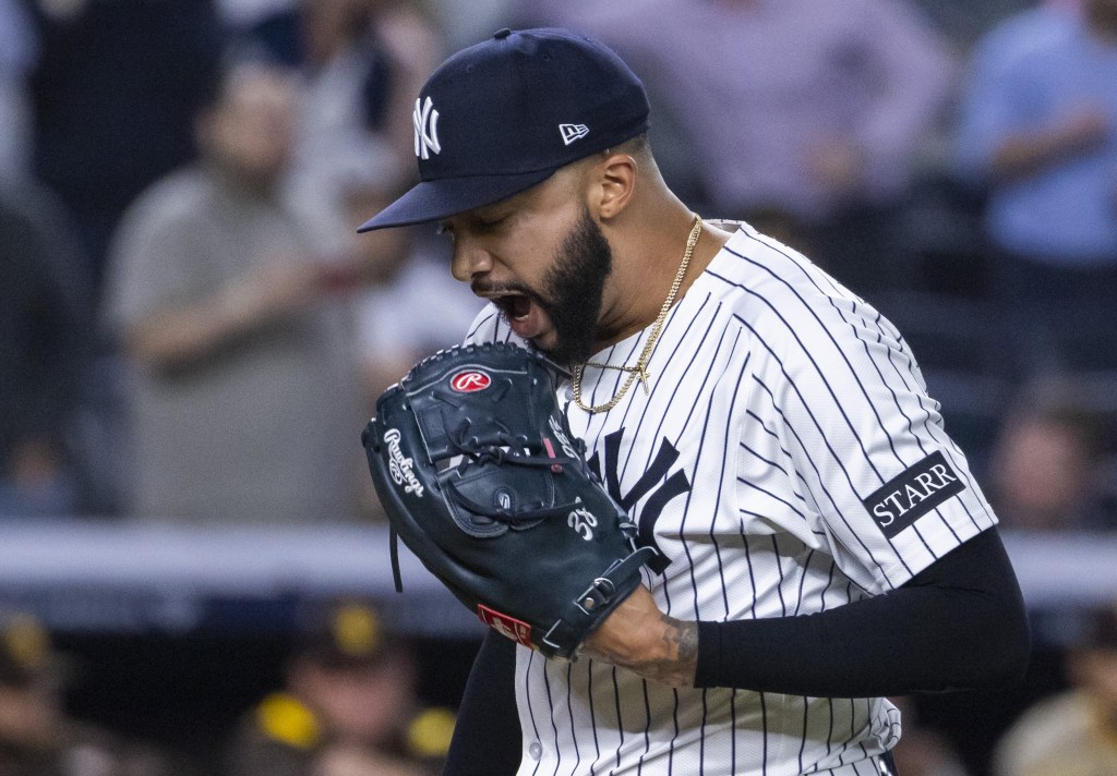 Devin Williams celebrates after getting out of the 10th inning in the Yankees' victory over the Padres.