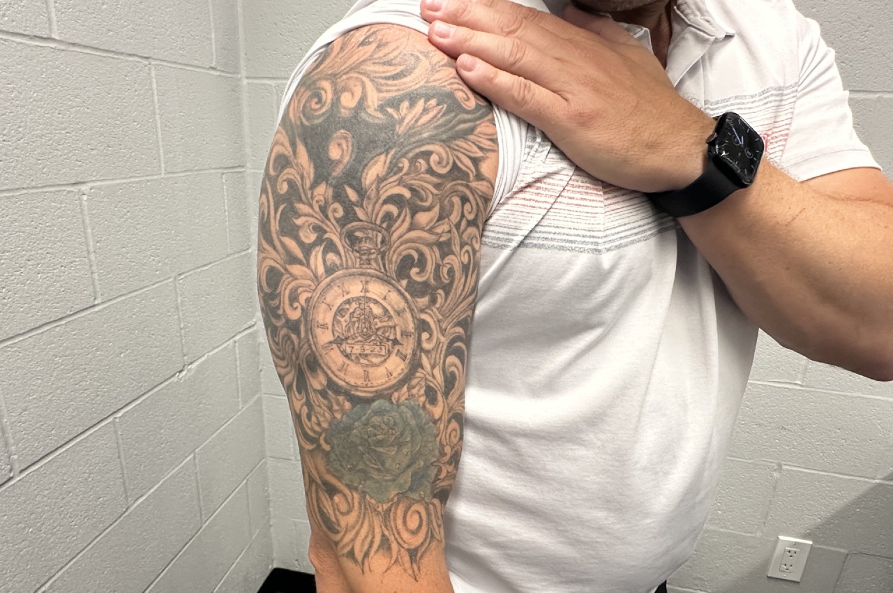 Umpire Scott Barry got this tattoo on his right arm in memory of his wife Christine after she passed away following a battle with cancer. (Blake Murphy/Sportsnet)
