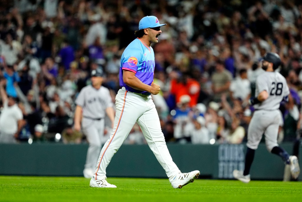 Zach Agnos celebrates after closing out the Rockies' 3-2 win over the Yankees on May 23, 2025.