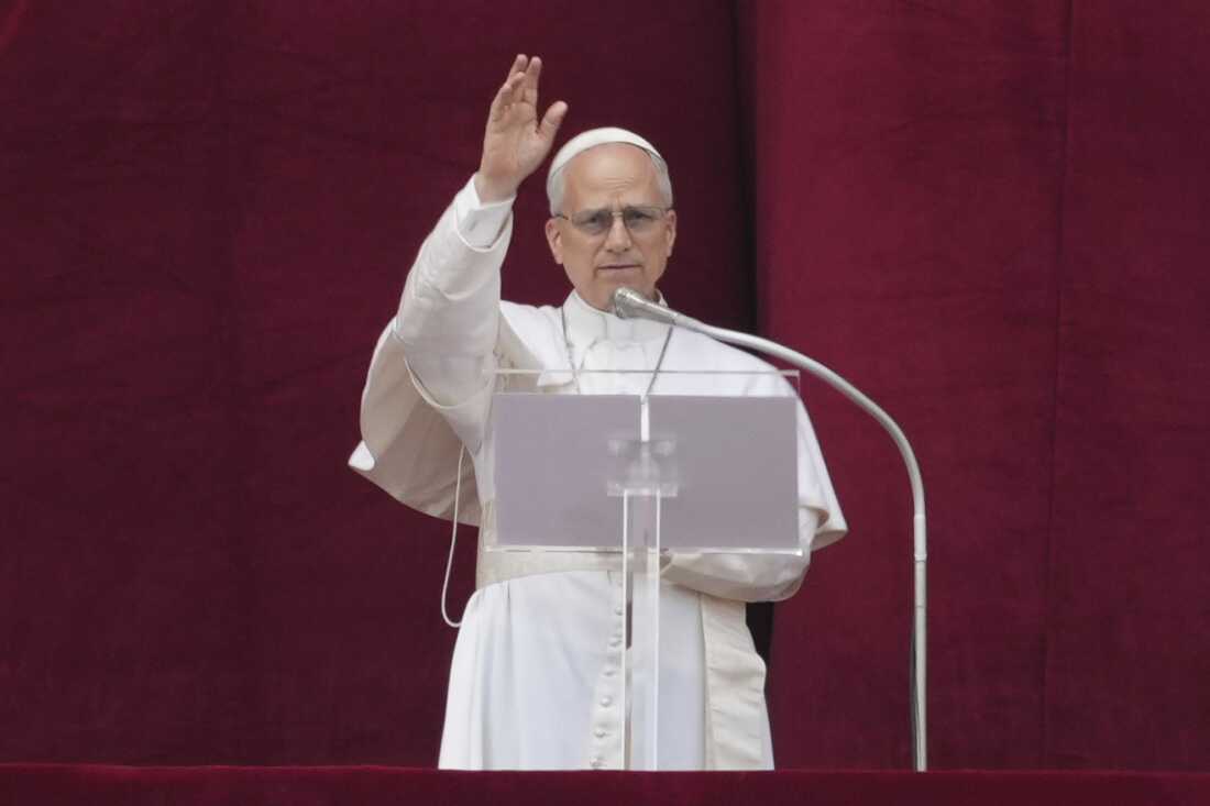 Pope Leo XIV delivers his blessing from the central balcony of St. Peter's Basilica for his first Sunday blessing after his election, in St. Peter's Square at the Vatican, Sunday, May 11, 2025.