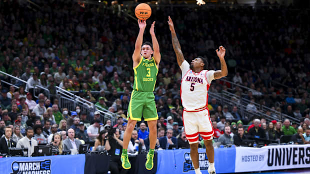 Mar 23, 2025; Seattle, WA, USA;  Oregon Ducks guard Jackson Shelstad (3) attempts a 3-point shot against Arizona Wildcats gua