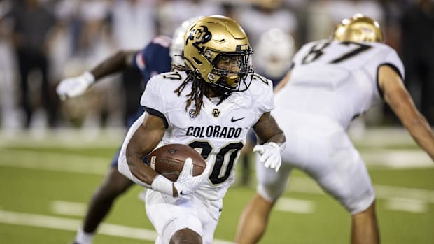 Colorado Buffaloes tailback Deion Smith (20) runs against the Arizona Wildcats in the first half at Arizona Stadium