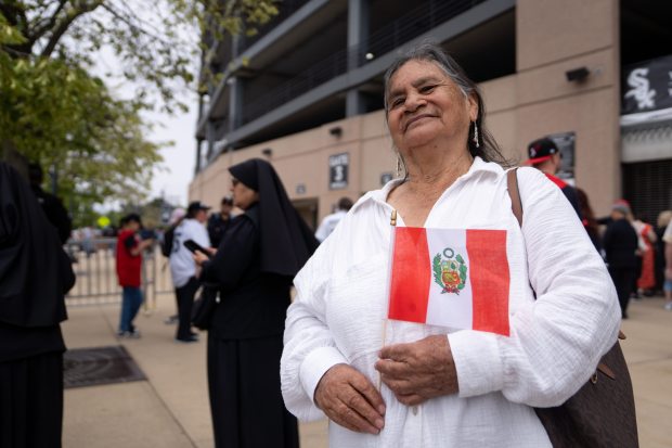 Maria Alarcon Monteza, of Chiclayo, Peru, poses for a portrait while waiting to enter Rate Field before celebrating the election of Pope Leo XIV with a citywide gathering and Catholic Mass on June 14, 2025. Monteza personally knew Pope Leo XIV. (Audrey Richardson/Chicago Tribune)