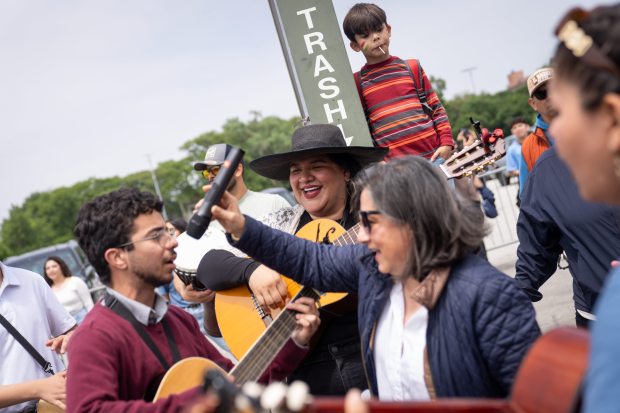 Members of Neocatechumenal Way gather outside of Rate Field before celebrating the election of Pope Leo XIV with a citywide gathering and Catholic Mass on June 14, 2025. (Audrey Richardson/Chicago Tribune)