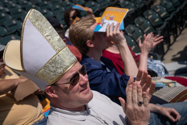 Matthew Fennell claps as programming begins while celebrating the election of Pope Leo XIV with a citywide gathering and Catholic Mass at Rate Field on June 14, 2025. (Audrey Richardson/Chicago Tribune)