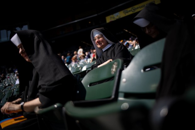 Sister Danuta Karwacka, with Albertine Sisters Serving, celebrates the election of Pope Leo XIV with a citywide gathering at Rate Field on June 14, 2025. (Audrey Richardson/Chicago Tribune)