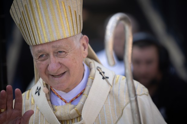 Cardinal Blase Cupich walks onto the baseball field at the beginning of a Catholic Mass begins while celebrating the election of Pope Leo XIV with a citywide gathering at Rate Field on June 14, 2025. (Audrey Richardson/Chicago Tribune)