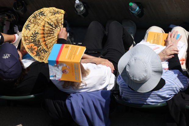 People attend a Mass at Rate Field on June 14th, 2025. (Antonio Perez/Chicago Tribune)